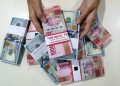 Rupiah melemah seiring meningkatnya permintaan dolar