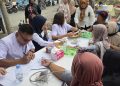 KAI Divre I Sumut Hadirkan Layanan Kesehatan Gratis bagi Warga di Serdang Bedagai, Bagi Kacamata Untuk 20 Anak Sekolah